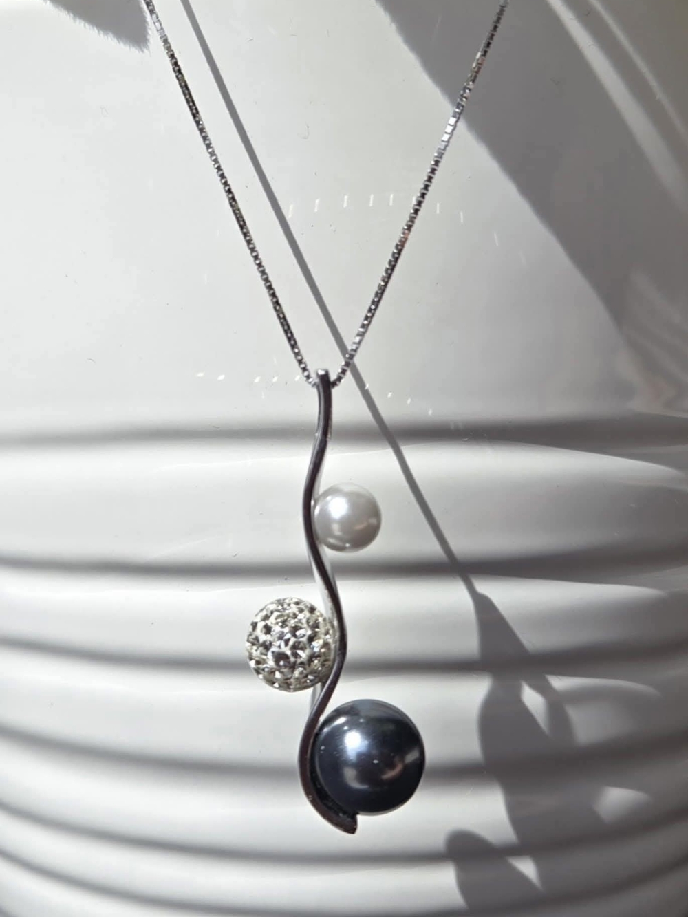 Elegant Silver Pendant Necklace with White Pearl, Crystal Orb and Black Pearl